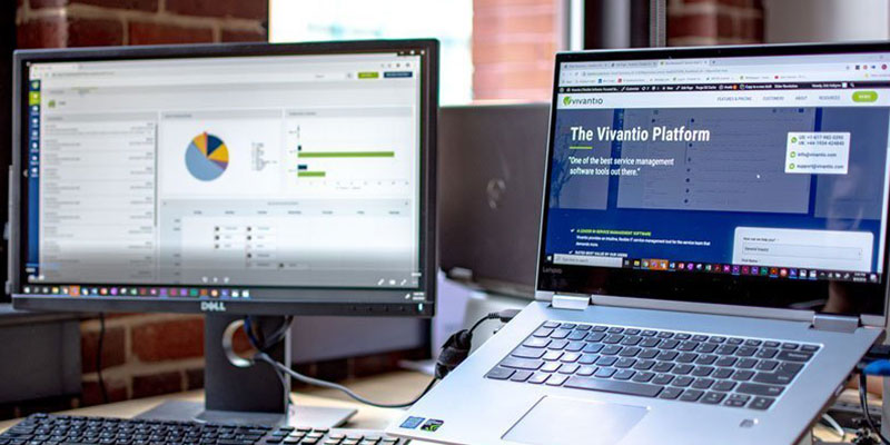 laptop and monitor displaying vivantio software UI